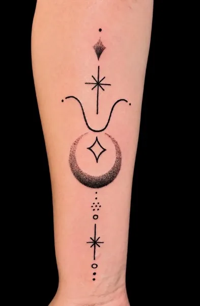 Crescent moon and stars — dot work tattoo on forearm