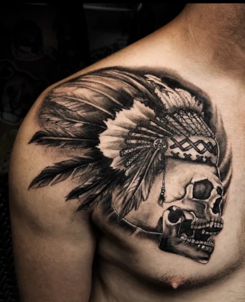 Headdress skull — Black & gray realism tattoo on chest / shoulder